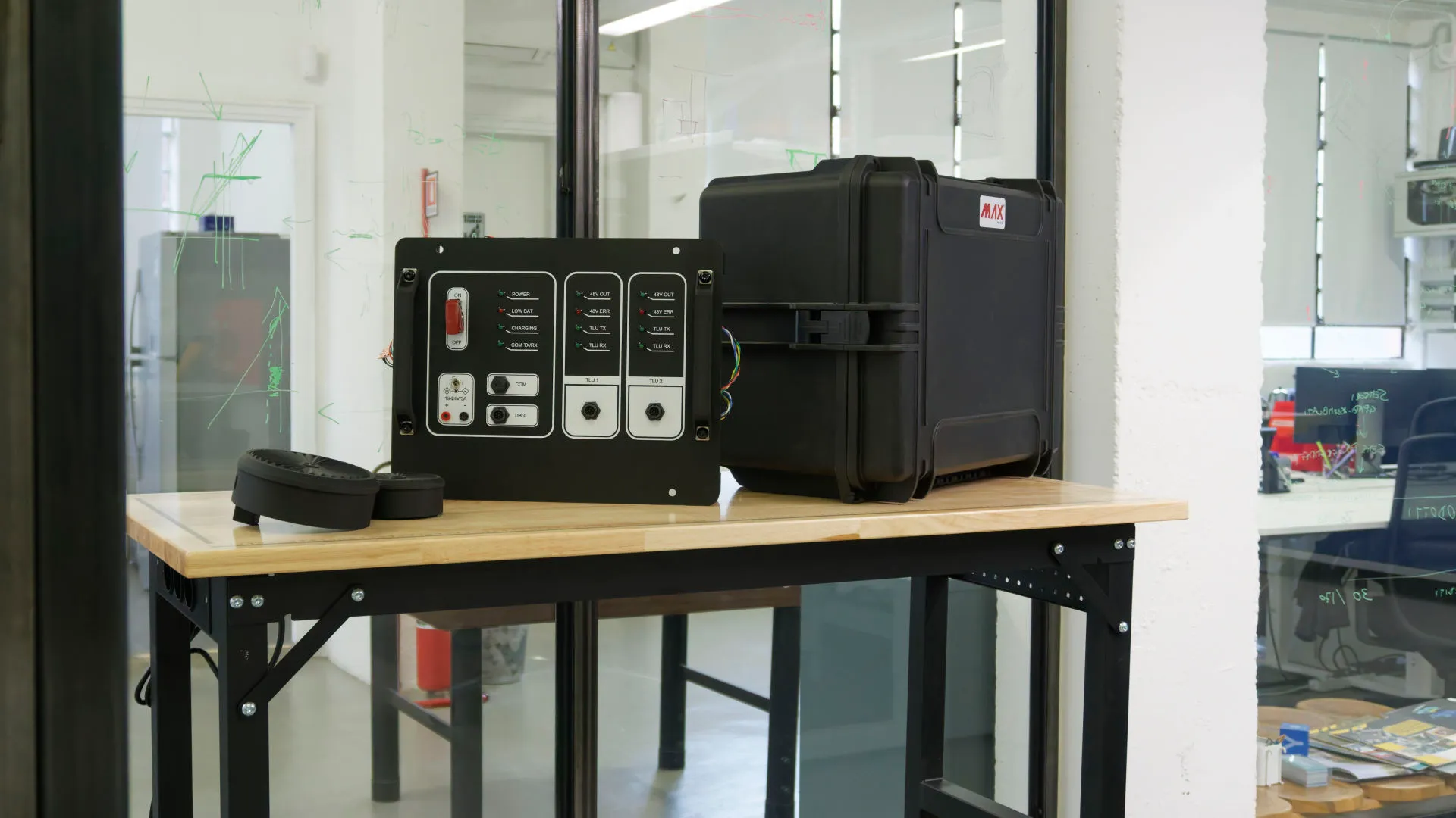 Control box and rugged case on a wooden bench